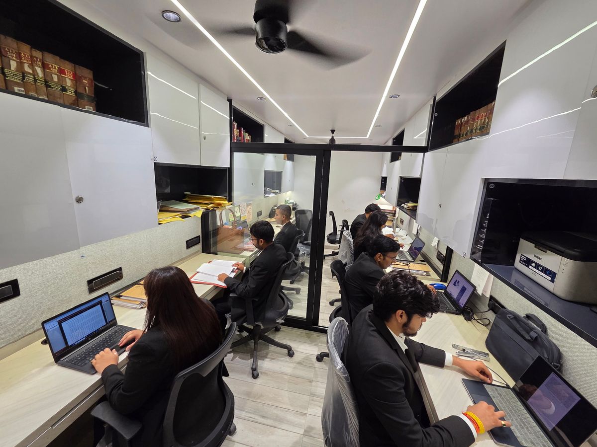 Legal staff members at Manuja Advocates office workspace